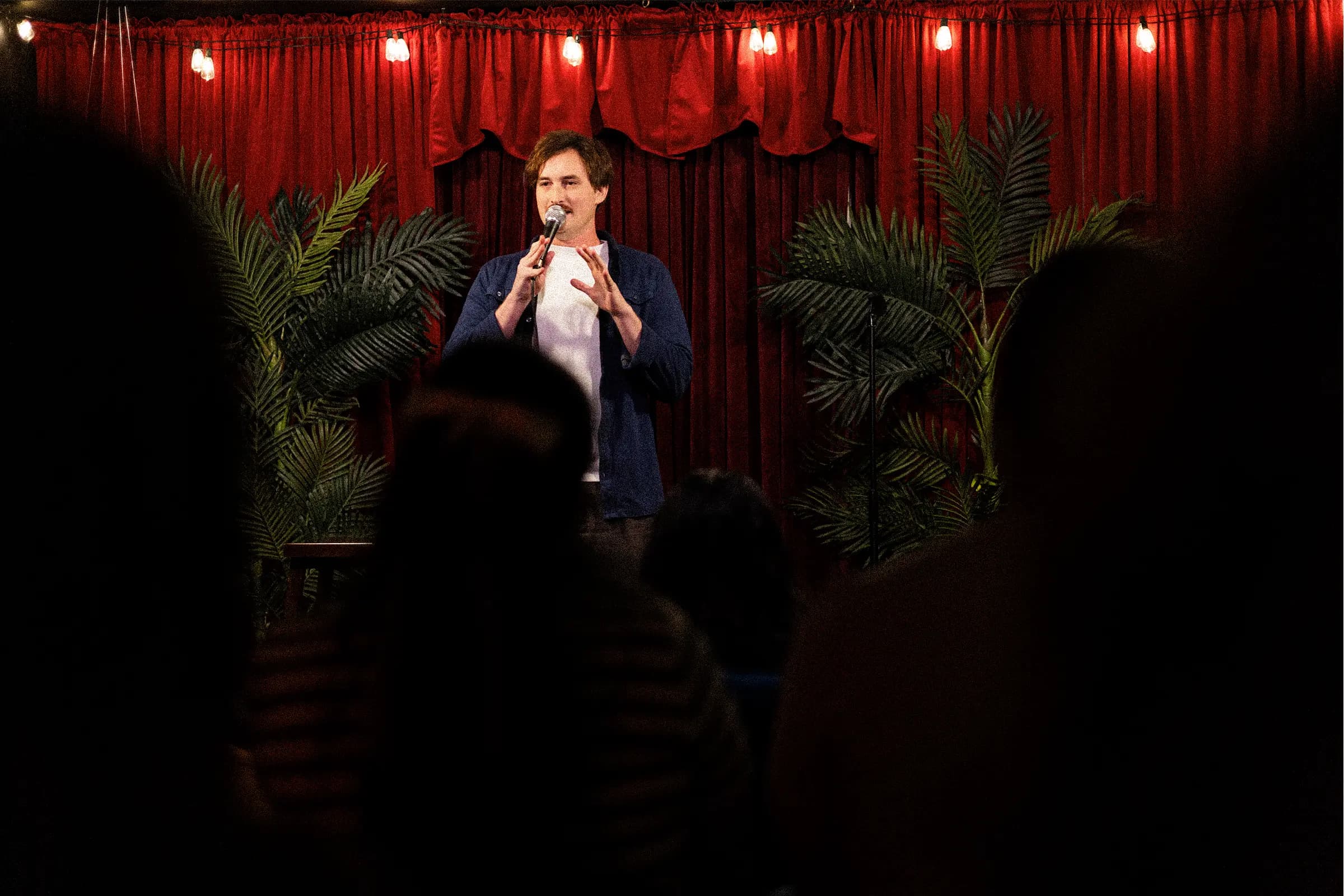 Badger Comedy stage with comic performing to intimate audience