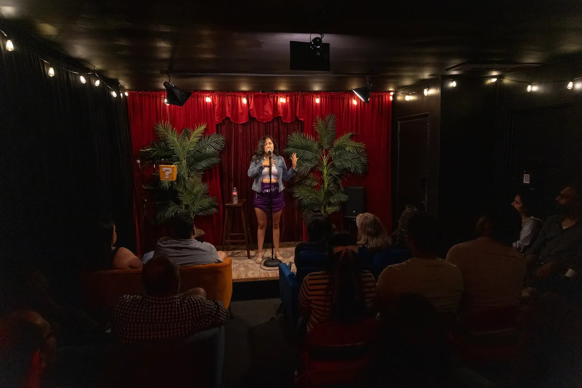 Esmeralda performing standup at Badger Comedy